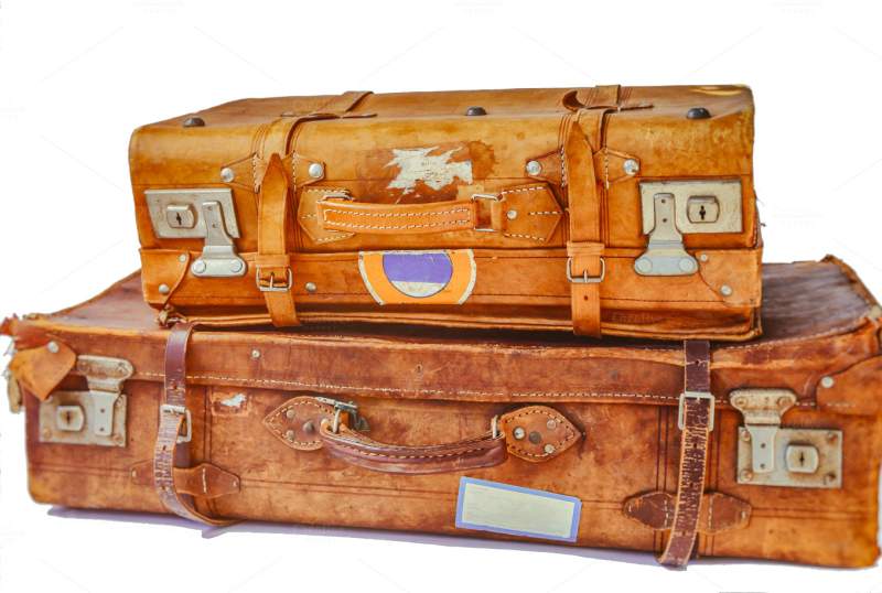 two stacked old leather suitcases